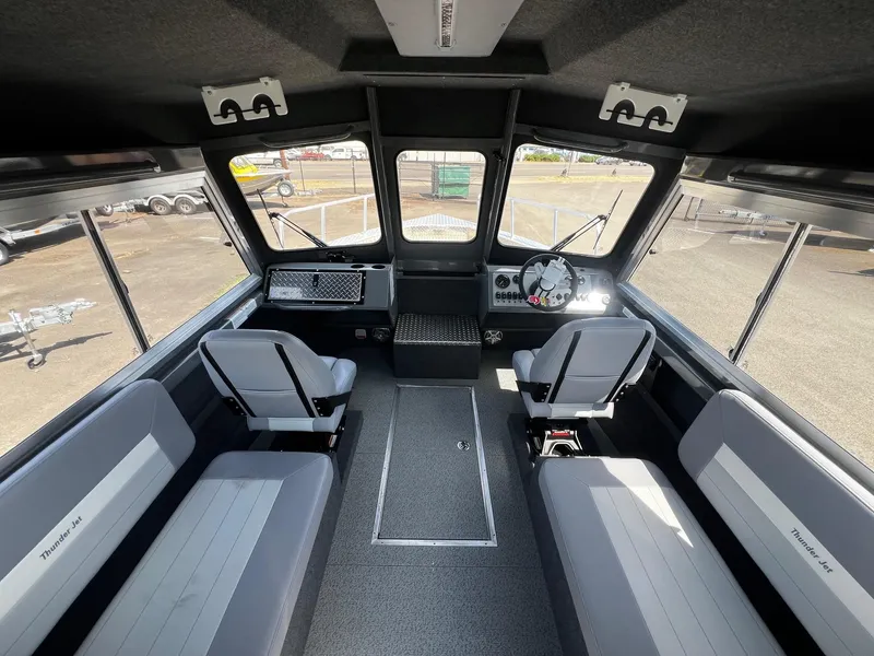 Slide: The Image of Interior of 2024 Thunder Jet 24 Alexis Pro boat with seating and dashboard. - 19