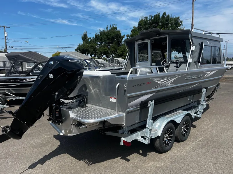 Slide: The Image of 2024 Thunder Jet 24 Alexis Pro boat on trailer, outdoor display. - 2