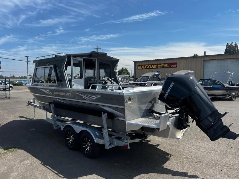 Slide: The Image of 2024 Thunder Jet 24 Alexis Pro boat on trailer, parked outdoors. - 3