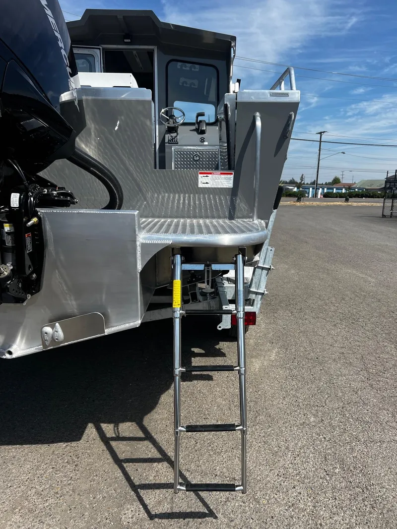 Slide: The Image of 2024 Thunder Jet 24 Alexis Pro boat with rear ladder and platform. - 37