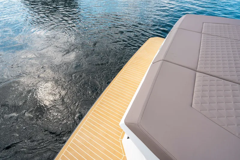 Slide: The Image of De Antonio Yachts D32 OPEN 2025, featuring sleek deck design on calm water. - 13