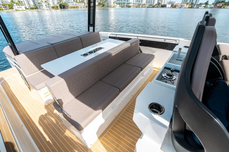Slide: The Image of 2025 De Antonio Yachts D32 OPEN interior with seating and table on deck. - 23