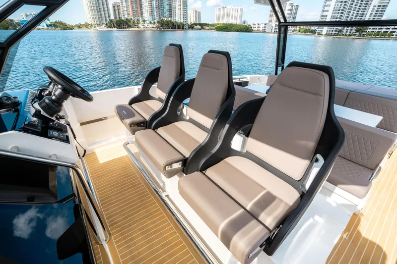 Slide: The Image of 2025 De Antonio Yachts D32 OPEN interior with modern seating and waterfront view. - 34