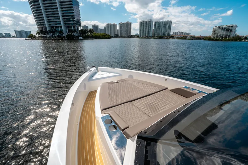 Slide: The Image of 2025 De Antonio Yachts D32 OPEN on water with city skyline in background. - 35