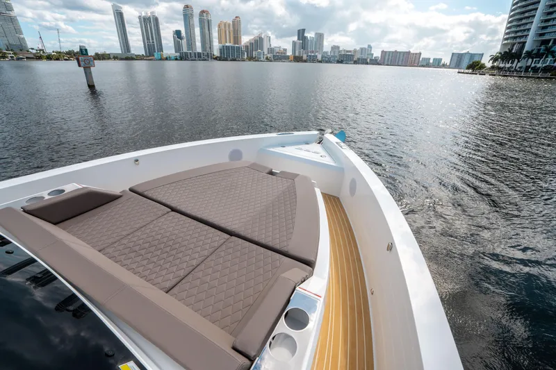 Slide: The Image of 2025 De Antonio Yachts D32 OPEN on water with city skyline in background. - 40