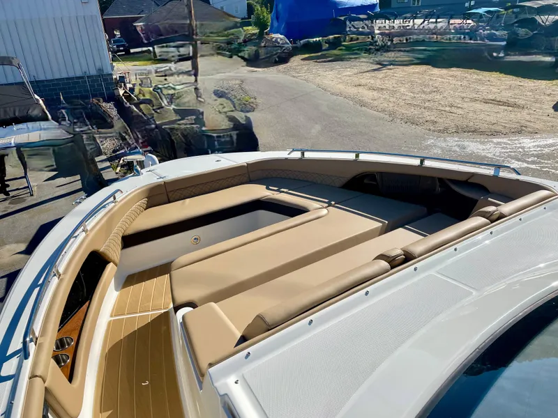 Slide: The Image of 2023 Sea Ray Sundancer 370 OB boat with spacious deck and luxurious seating. - 14