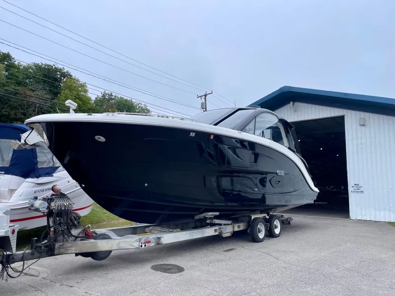 Slide: The Image of 2023 Sea Ray Sundancer 370 OB on trailer near storage facility. - 9