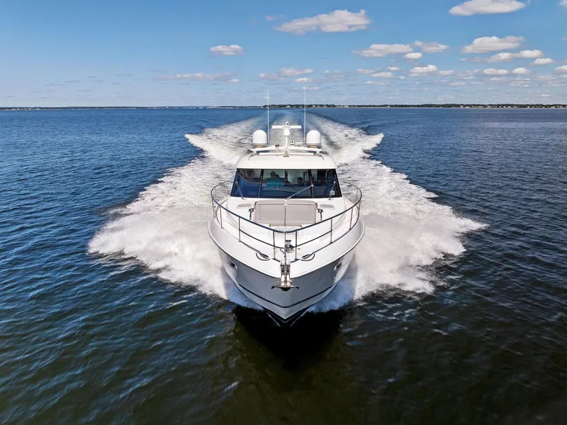 Slide: The Image of 2017 Riviera Sport Yacht cruising on open water under a clear blue sky. - 10
