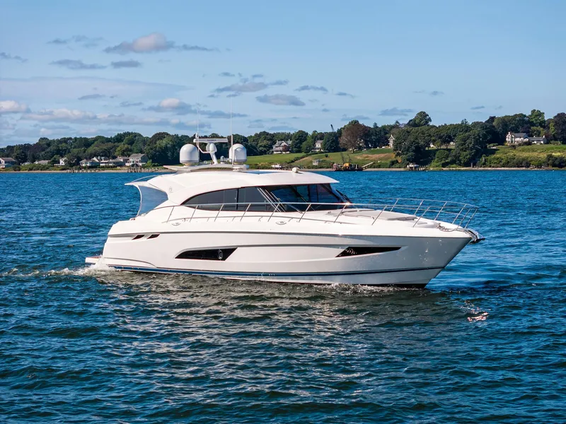 Slide: The Image of 2017 Riviera Sport Yacht cruising on a scenic blue lake. - 12