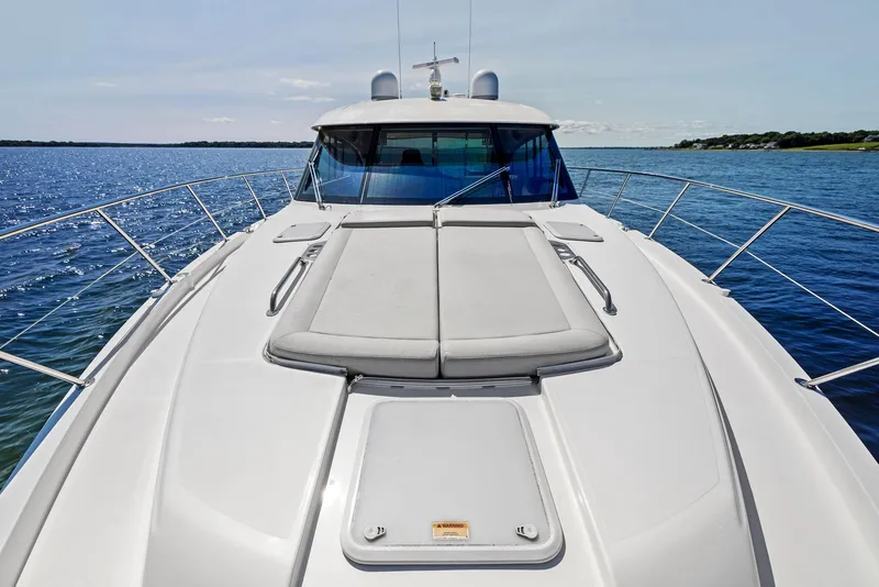 Slide: The Image of 2017 Riviera Sport Yacht on calm blue waters, showcasing sleek deck design. - 13