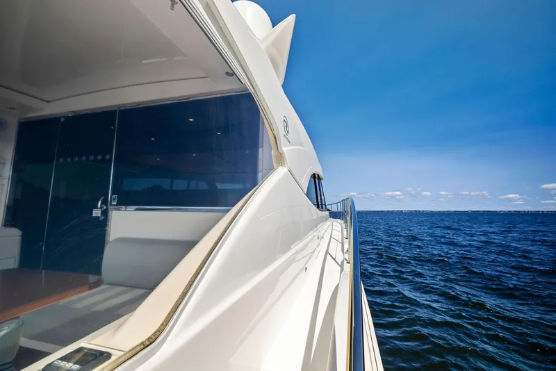 Slide: The Image of 2017 Riviera Sport Yacht cruising on open sea under clear blue sky. - 15