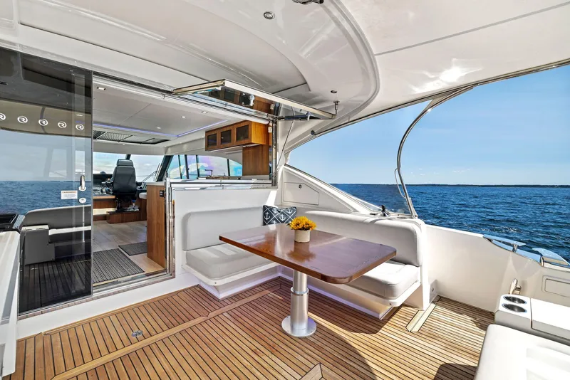 Slide: The Image of Luxurious 2017 Riviera Sport Yacht interior with ocean view and elegant seating area. - 17