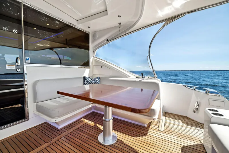 Slide: The Image of Luxurious 2017 Riviera Sport Yacht interior with ocean view and elegant seating area. - 18