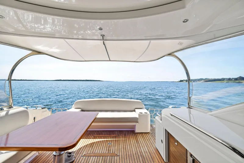 Slide: The Image of Luxurious 2017 Riviera Sport Yacht interior with ocean view and elegant seating area. - 20