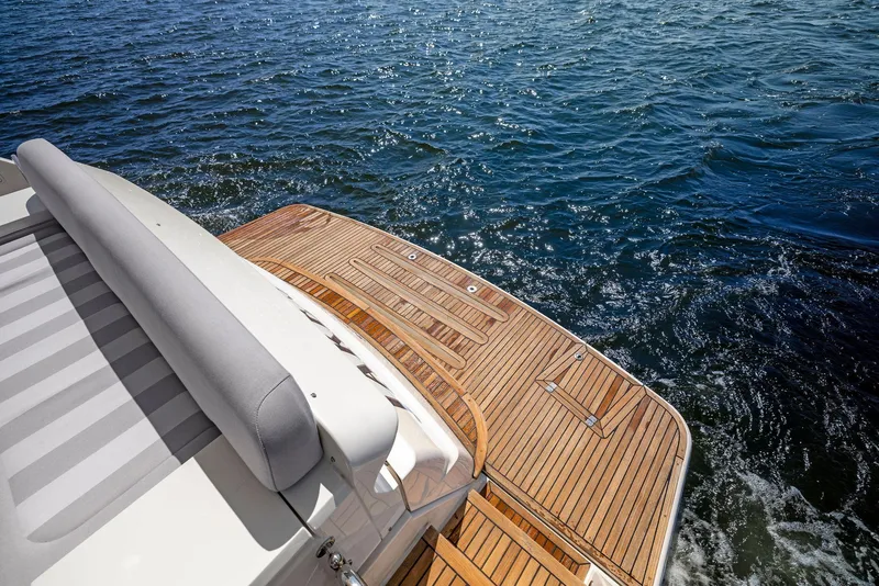 Slide: The Image of 2017 Riviera Sport Yacht with teak deck on open water. - 24