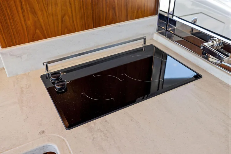 Slide: The Image of Modern kitchen cooktop on 2017 Riviera Sport Yacht. - 31