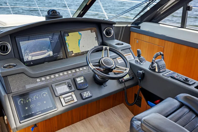Slide: The Image of 2017 Riviera Sport Yacht helm with advanced navigation and control systems. - 39