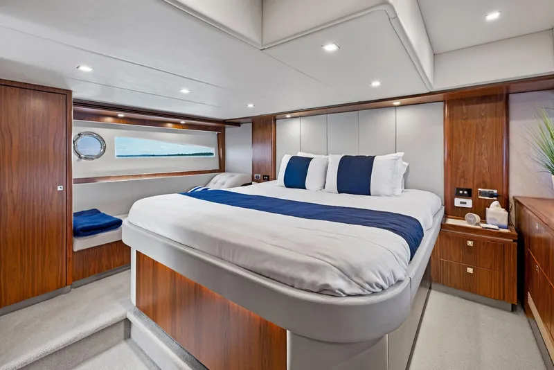 Slide: The Image of Luxurious 2017 Riviera Sport Yacht bedroom with elegant wood finishes and modern design. - 42