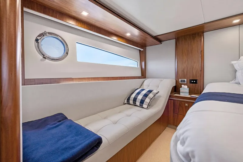 Slide: The Image of Luxurious 2017 Riviera Sport Yacht interior with elegant wood finishes and comfortable seating. - 44