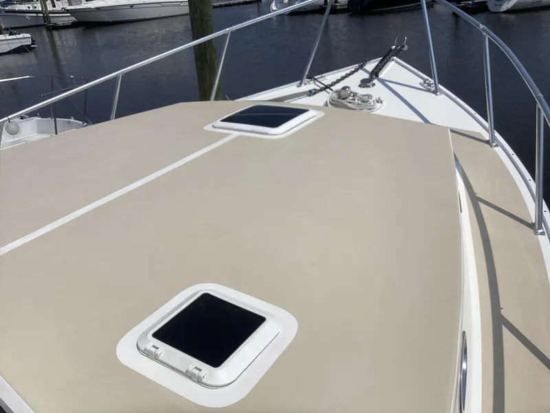 Slide: The Image of Willis Beal 35 Extended Pilothouse 2021 boat deck with hatches, docked at marina. - 15