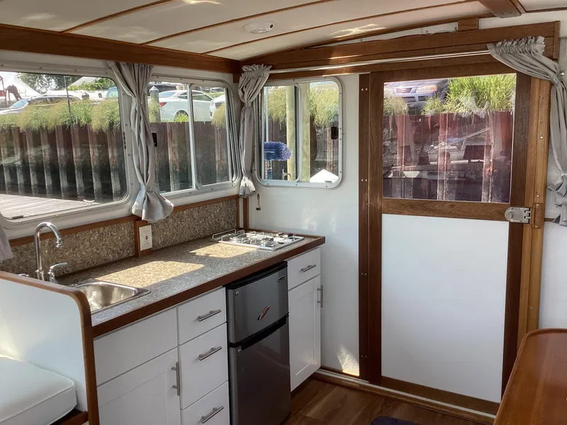 Slide: The Image of Interior of 2021 Willis Beal 35 Extended Pilothouse with kitchenette and windows. - 17