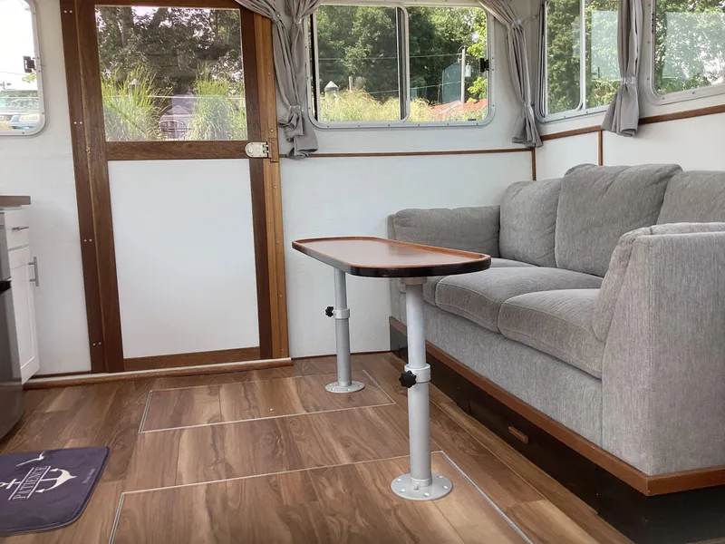 Slide: The Image of Interior of 2021 Willis Beal 35 Extended Pilothouse with sofa and table. - 18