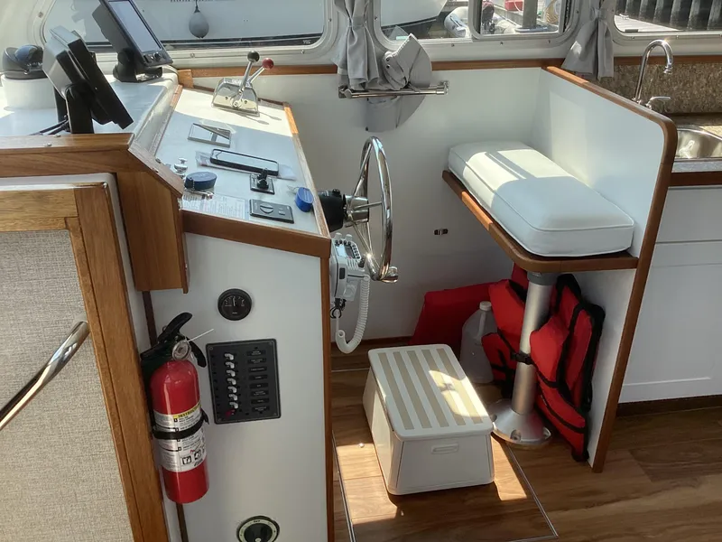 Slide: The Image of Interior of 2021 Willis Beal 35 Extended Pilothouse with helm, seating, and safety equipment. - 20