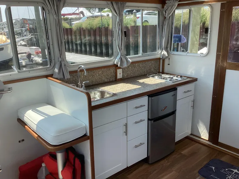 Slide: The Image of Interior of 2021 Willis Beal 35 Extended Pilothouse with kitchenette and seating. - 21