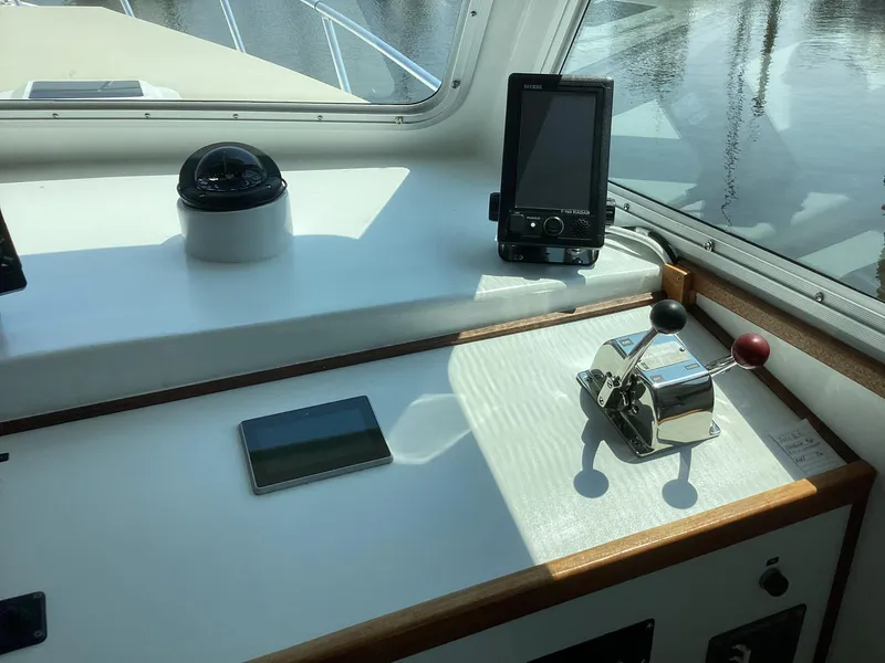 Slide: The Image of Pilothouse interior of 2021 Willis Beal 35 Extended, featuring navigation equipment and controls. - 26