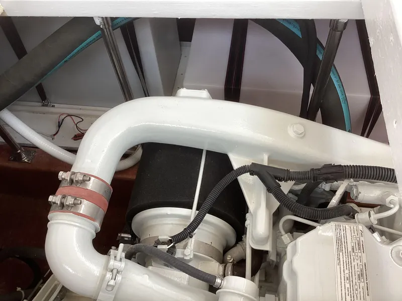 Slide: The Image of Engine compartment of 2021 Willis Beal 35 Extended Pilothouse boat, showcasing mechanical components. - 33