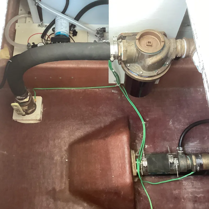 Slide: The Image of Engine compartment of 2021 Willis Beal 35 Extended Pilothouse, showing hoses and fittings. - 35