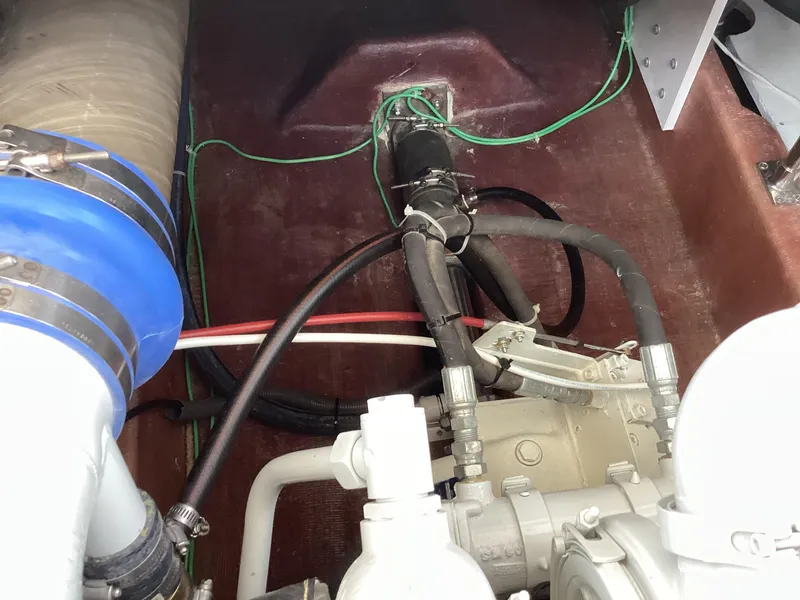 Slide: The Image of Engine compartment of 2021 Willis Beal 35 Extended Pilothouse with visible hoses and wiring. - 39
