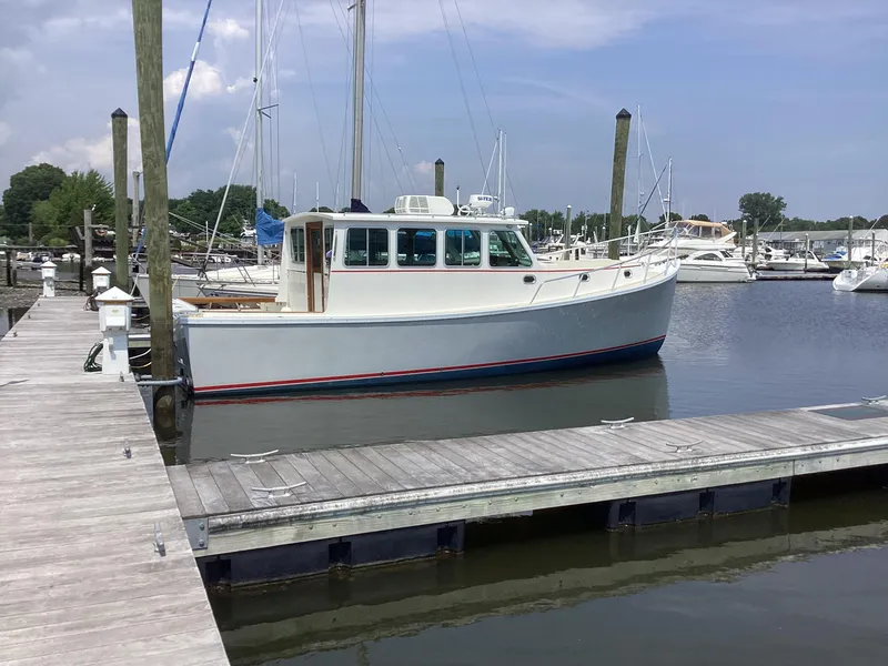 Slide: The Image of 2021 Willis Beal 35 Extended Pilothouse docked at a marina. - 4