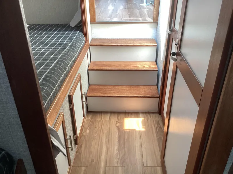 Slide: The Image of Interior of 2021 Willis Beal 35 Extended Pilothouse with wooden steps and cozy cabin. - 41