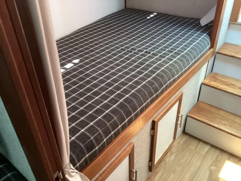 Slide: The Image of Cozy cabin bed in 2021 Willis Beal 35 Extended Pilothouse with checkered bedding. - 45