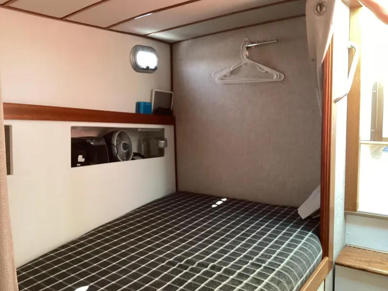 Slide: The Image of Cozy cabin interior of 2021 Willis Beal 35 Extended Pilothouse with bed and storage. - 47