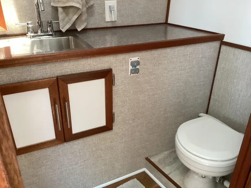 Slide: The Image of Compact bathroom in 2021 Willis Beal 35 Extended Pilothouse with sink and toilet. - 49