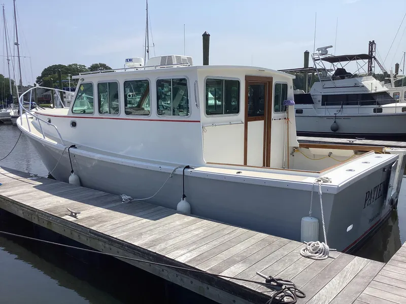 Slide: The Image of Willis Beal 35 Extended Pilothouse boat docked at marina, 2021 model. - 6