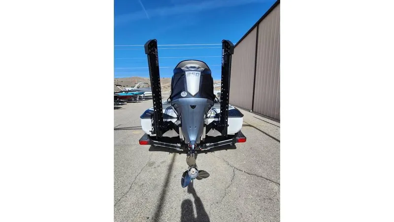 Slide: The Image of 2024 Skeeter FXR 20 Limited boat, rear view, parked outdoors. - 2