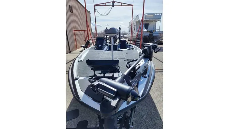 Slide: The Image of 2024 Skeeter FXR 20 Limited boat, front view, docked outdoors. - 3