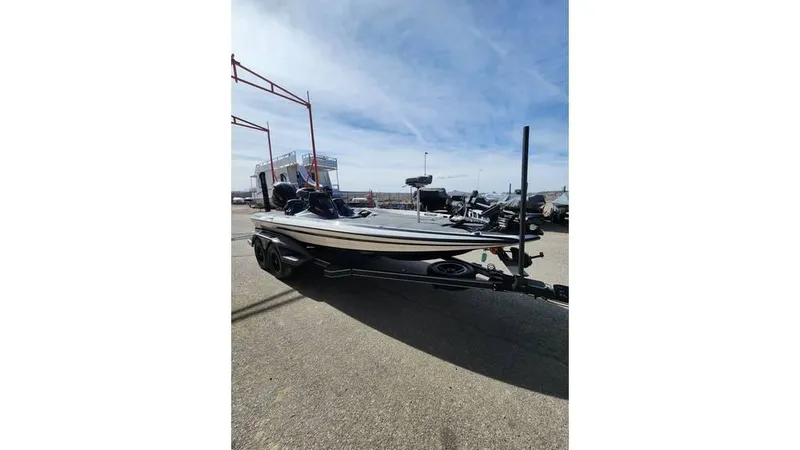 Slide: The Image of 2024 Skeeter FXR 20 Limited boat on trailer under clear sky. - 5
