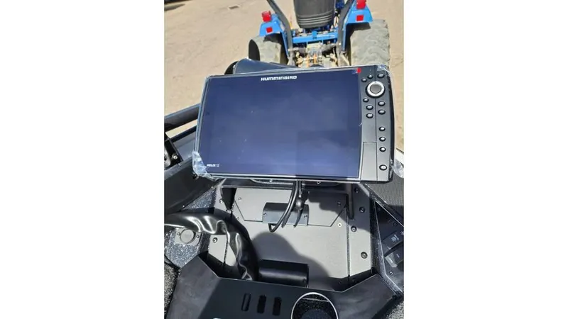 Slide: The Image of 2024 Skeeter FXR 20 Limited boat with Humminbird fish finder display. - 6