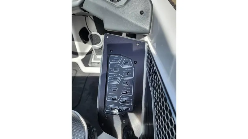 Slide: The Image of 2024 Skeeter FXR 20 Limited control panel with labeled switches and buttons. - 7