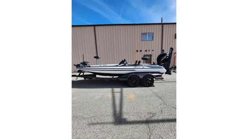 Slide: The Image of 2024 Skeeter FXR 20 Limited boat parked outdoors, side view. - 9