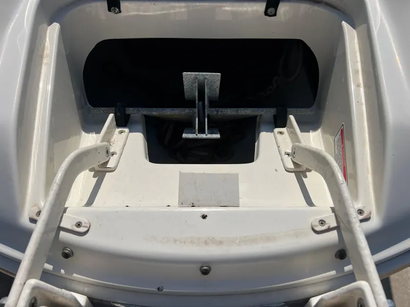 Slide: The Image of Anchor compartment of 2006 Sea Ray 240 Sundeck boat. - 24