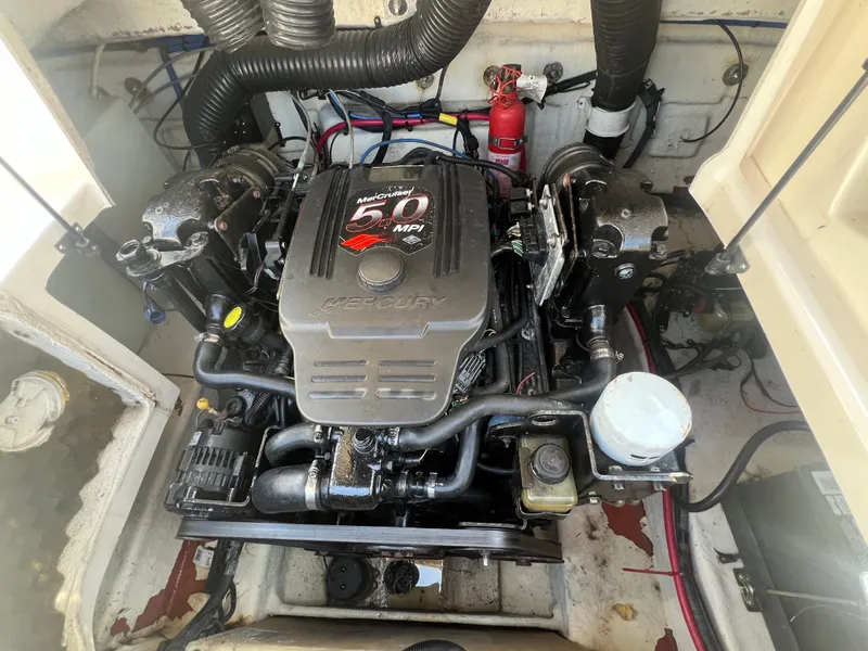 Slide: The Image of 2006 Sea Ray 240 Sundeck engine compartment with MerCruiser 5.0 MPI engine. - 28