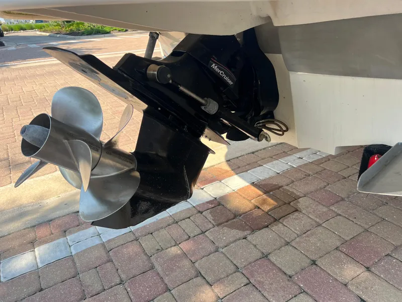 Slide: The Image of Close-up of 2006 Sea Ray 240 Sundeck boat propeller on pavement. - 29