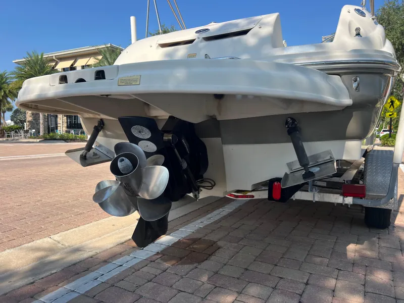 Slide: The Image of 2006 Sea Ray 240 Sundeck boat on trailer, rear view showing propeller and outdrive. - 5