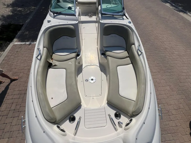 Slide: The Image of 2006 Sea Ray 240 Sundeck boat with spacious seating and sleek design. - 6