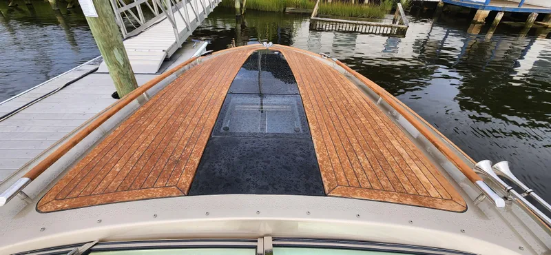 Slide: The Image of 2017 Chris-Craft Corsair 32 boat with teak deck, docked at marina. - 11